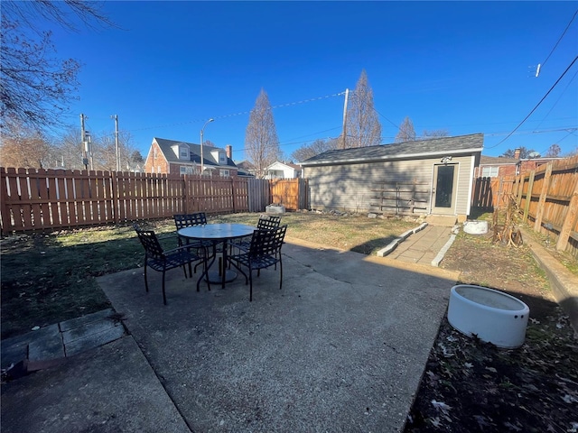 view of patio / terrace with an outbuilding