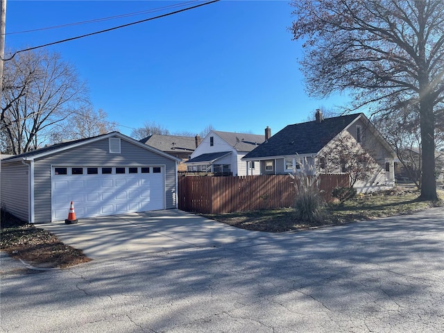 view of side of property with a garage and an outdoor structure