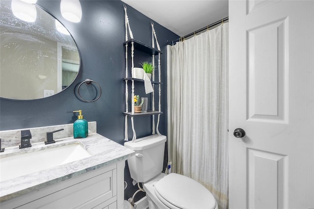 bathroom with vanity, toilet, and a shower with shower curtain