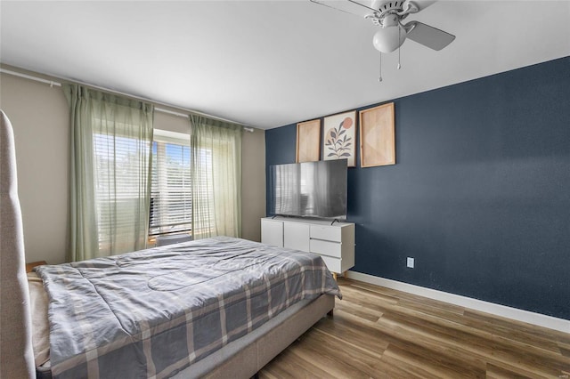 bedroom featuring ceiling fan and light hardwood / wood-style floors