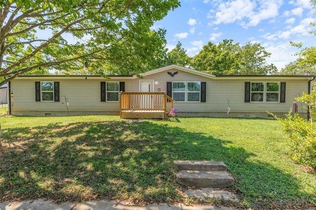 view of front of house with a front lawn and a wooden deck