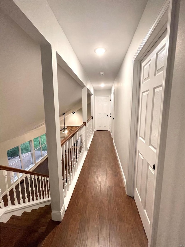 hall with dark wood-type flooring