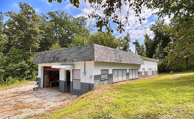 view of stable with an outdoor structure and a yard