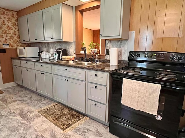 kitchen featuring backsplash, sink, electric range, gray cabinetry, and light tile patterned floors