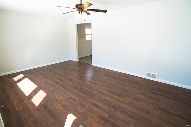 spare room featuring ceiling fan and dark hardwood / wood-style flooring