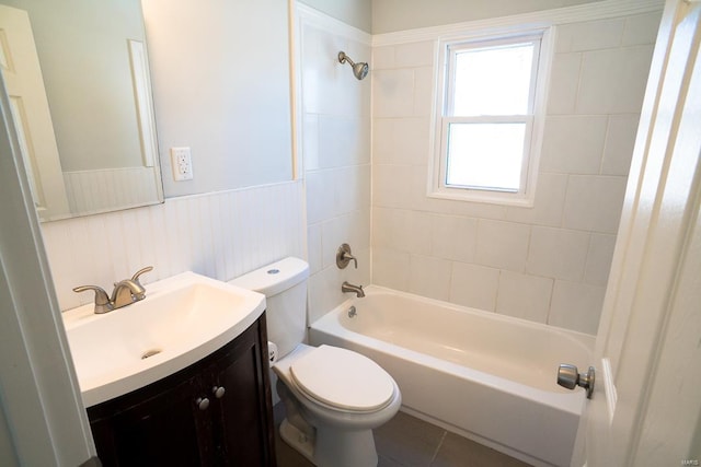 full bath featuring vanity, toilet, a wainscoted wall, and shower / bathing tub combination