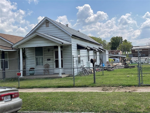 bungalow-style house with a porch and a front yard