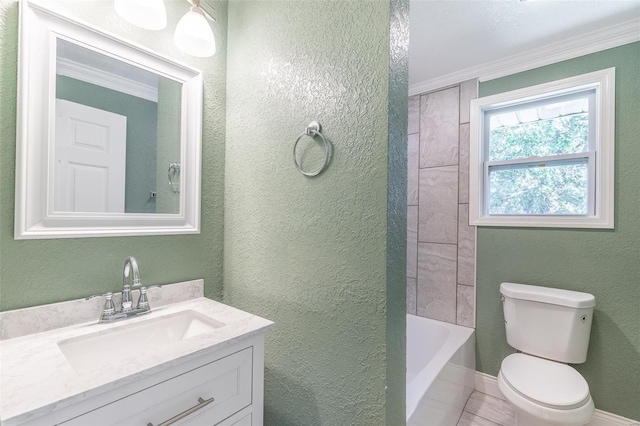 bathroom with tile patterned flooring, crown molding, vanity, and toilet