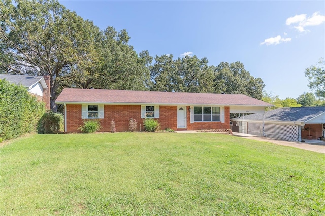 ranch-style house with a front lawn