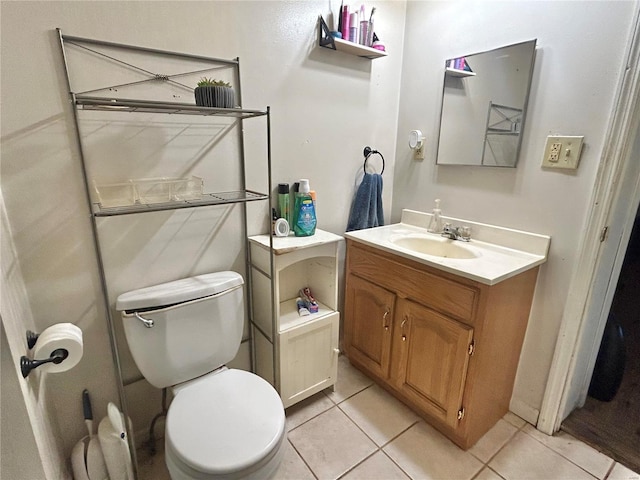 bathroom with vanity, tile patterned floors, and toilet