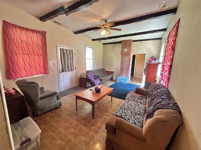 living room with beamed ceiling and ceiling fan