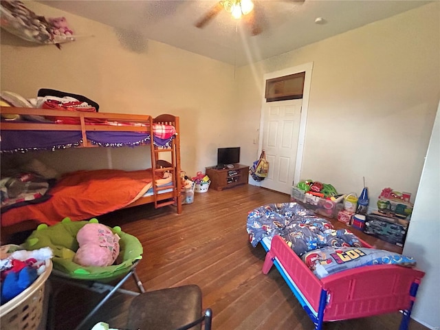 bedroom featuring wood-type flooring and ceiling fan