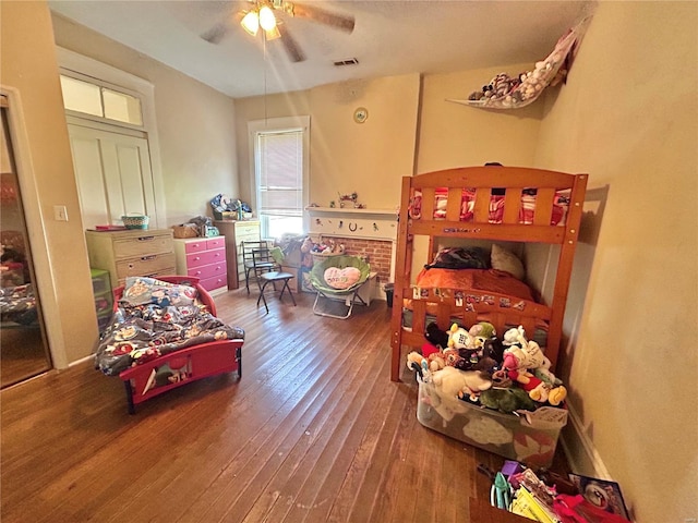 bedroom with hardwood / wood-style flooring and ceiling fan