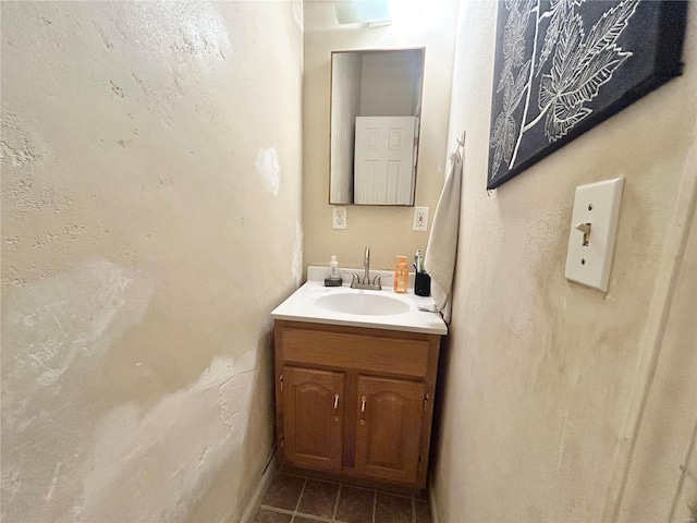 bathroom with tile patterned floors and vanity