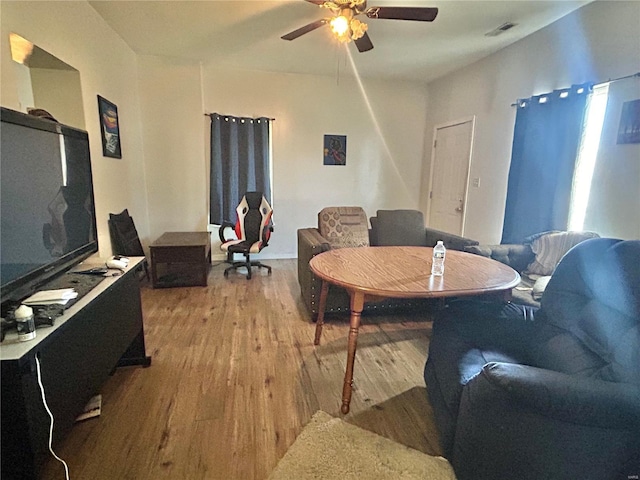 dining area featuring ceiling fan and light wood-type flooring