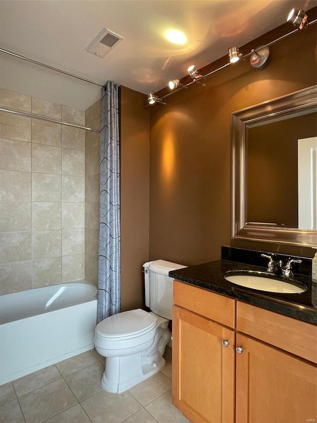 full bathroom with shower / bathtub combination with curtain, toilet, vanity, and tile patterned floors