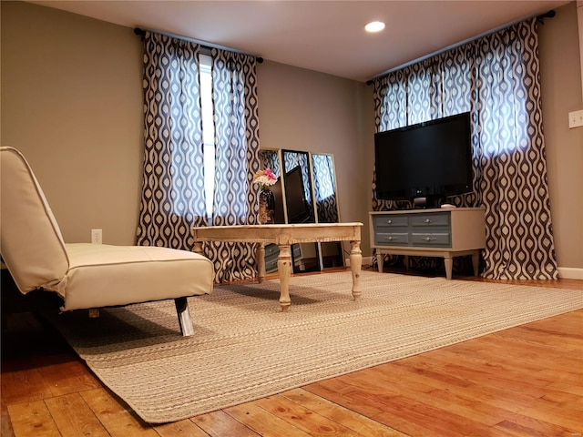 living area with hardwood / wood-style floors