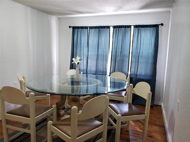 dining area featuring wood-type flooring