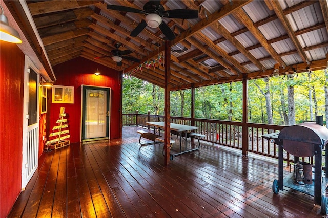 wooden terrace featuring ceiling fan and area for grilling