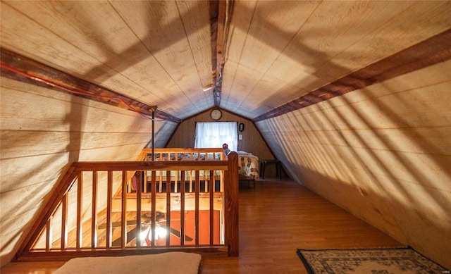 additional living space with vaulted ceiling, hardwood / wood-style floors, and wood ceiling