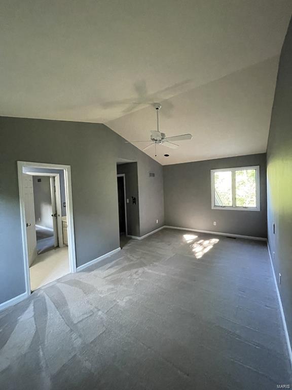 unfurnished bedroom with lofted ceiling and ceiling fan