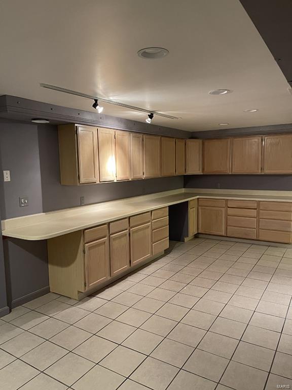 kitchen featuring light brown cabinetry and light tile patterned floors