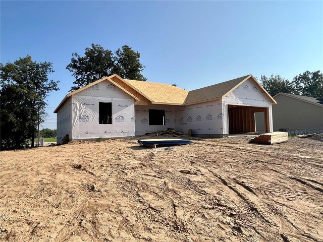 property in mid-construction with a garage