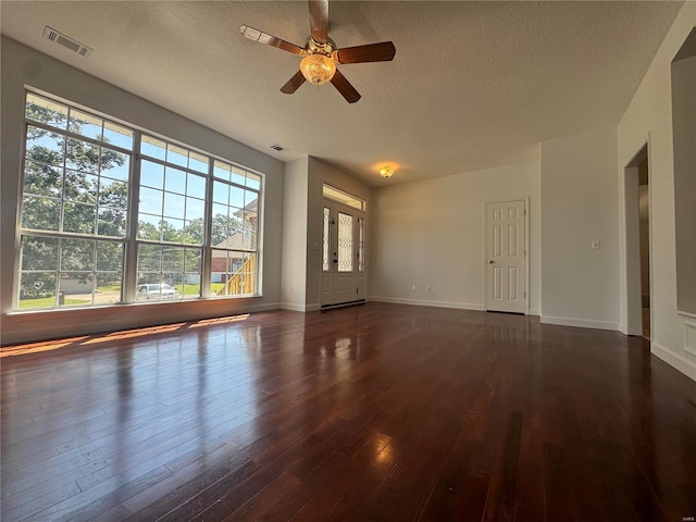 interior space featuring ceiling fan, a textured ceiling, and hardwood / wood-style floors