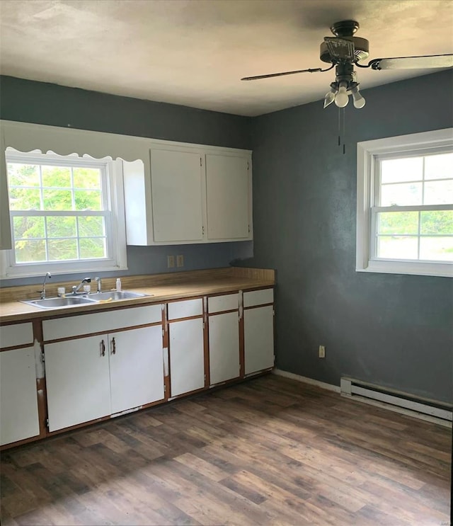 kitchen with hardwood / wood-style floors, sink, a wealth of natural light, white cabinets, and ceiling fan