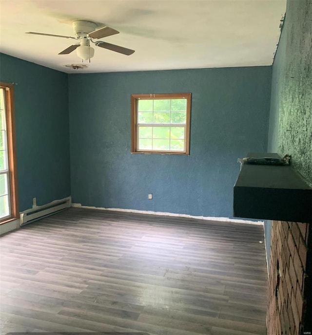 empty room featuring pool table, ceiling fan, hardwood / wood-style floors, and baseboard heating