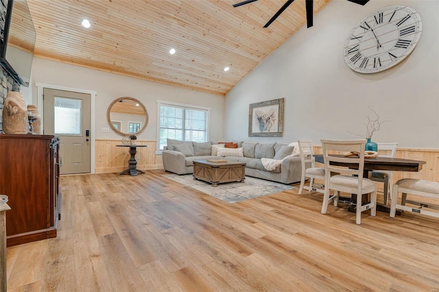 living room with ceiling fan, high vaulted ceiling, wooden ceiling, and light hardwood / wood-style floors