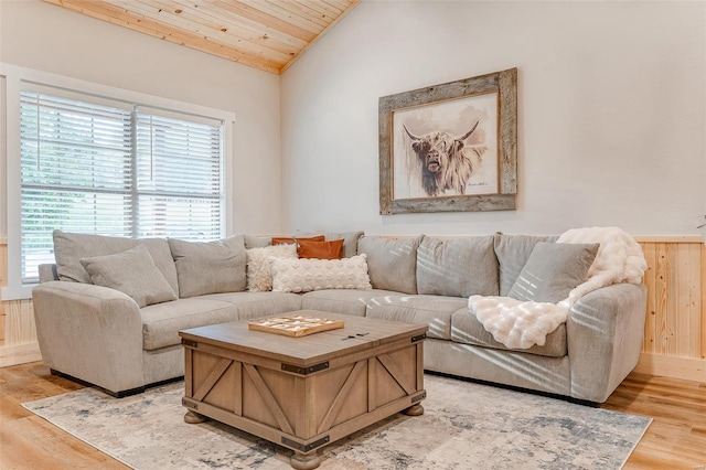 living room featuring light wood-type flooring, lofted ceiling, and wooden ceiling