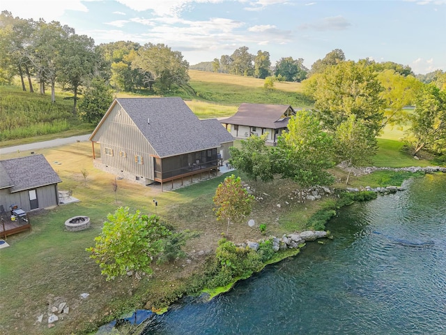 drone / aerial view with a water view