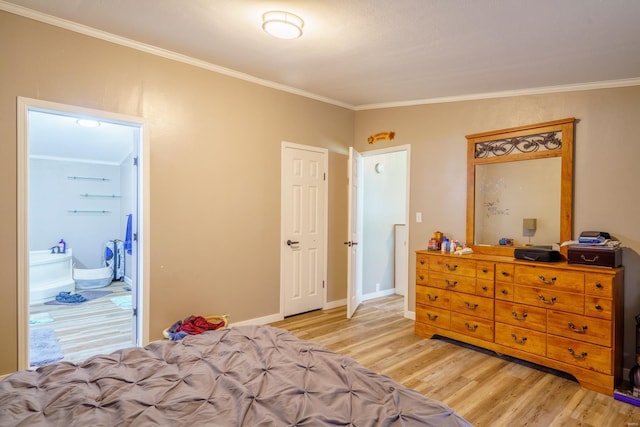 bedroom featuring ornamental molding, light wood-type flooring, and baseboards