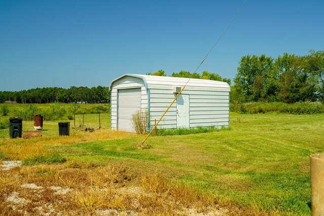 view of outdoor structure featuring a lawn