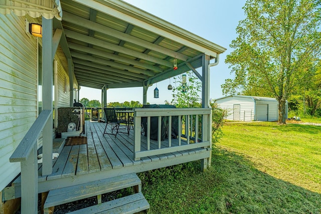 wooden terrace with an outbuilding, a yard, and a storage unit