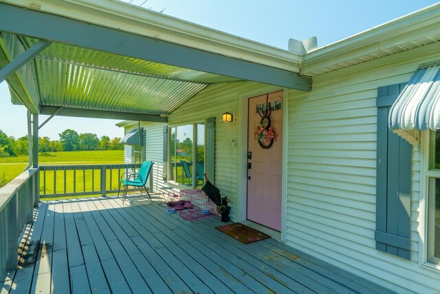 wooden deck with a lawn