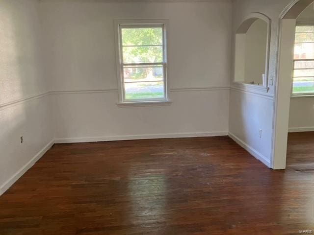 spare room featuring dark hardwood / wood-style flooring