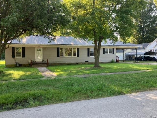 single story home featuring a front lawn