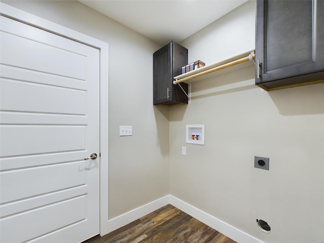 laundry area with washer hookup, electric dryer hookup, dark hardwood / wood-style flooring, and cabinets