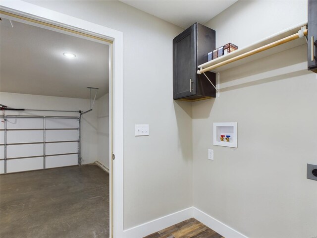 washroom featuring washer hookup, cabinets, and electric dryer hookup