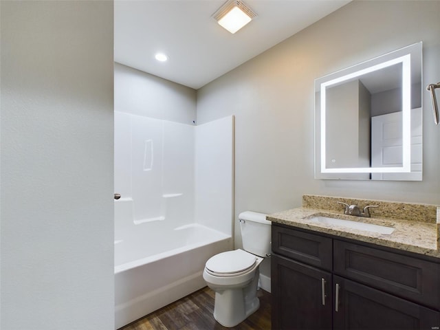 full bathroom with toilet, shower / bathtub combination, wood-type flooring, and vanity