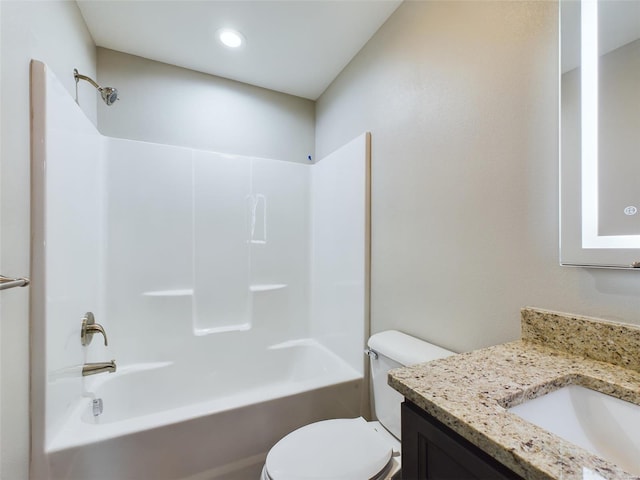 full bathroom with toilet, vanity, and shower / washtub combination