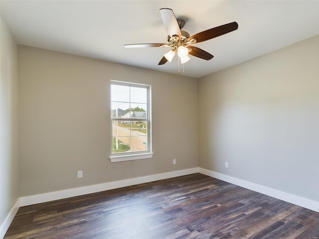 empty room with ceiling fan and hardwood / wood-style flooring