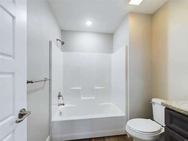 full bathroom with shower / bathtub combination, toilet, vanity, and hardwood / wood-style flooring