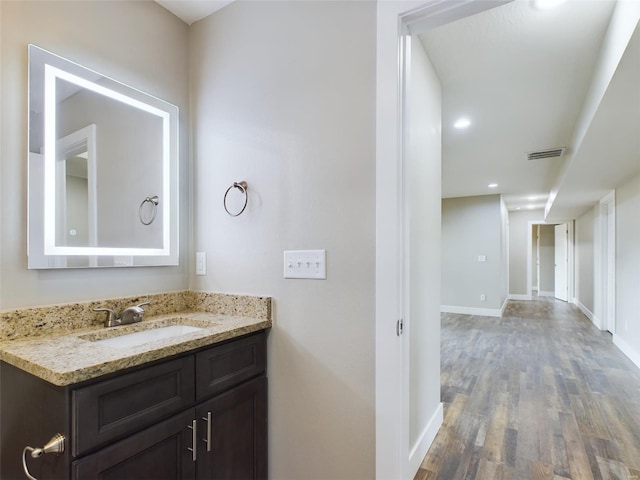 bathroom with wood-type flooring and vanity