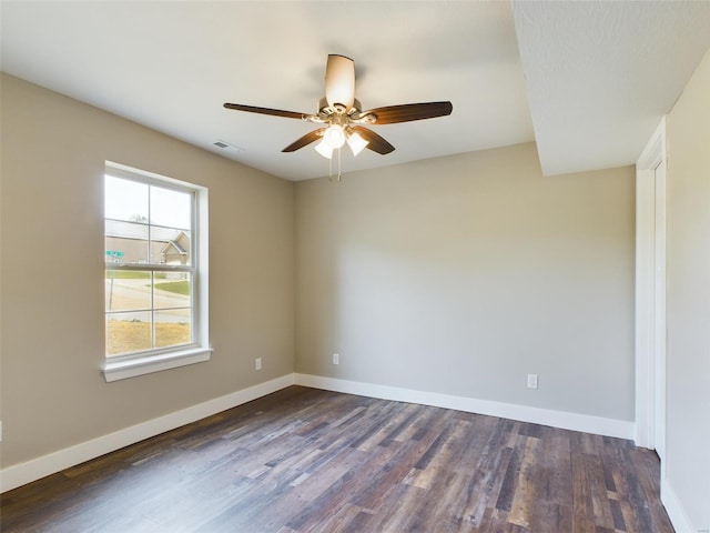 empty room featuring ceiling fan and hardwood / wood-style floors