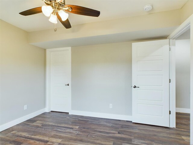 unfurnished room featuring ceiling fan and dark hardwood / wood-style floors