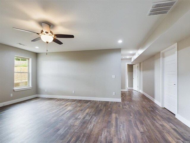 unfurnished room with ceiling fan and dark hardwood / wood-style floors