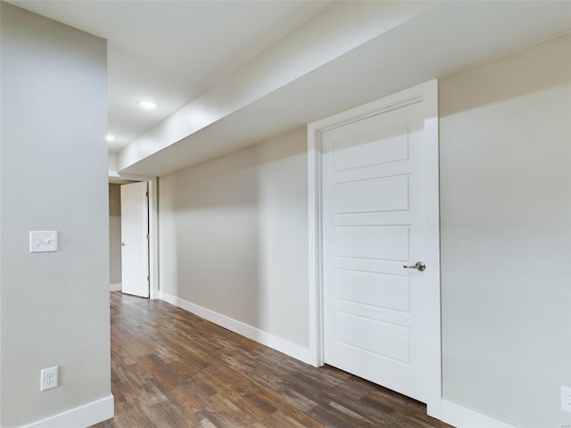 corridor featuring dark hardwood / wood-style flooring